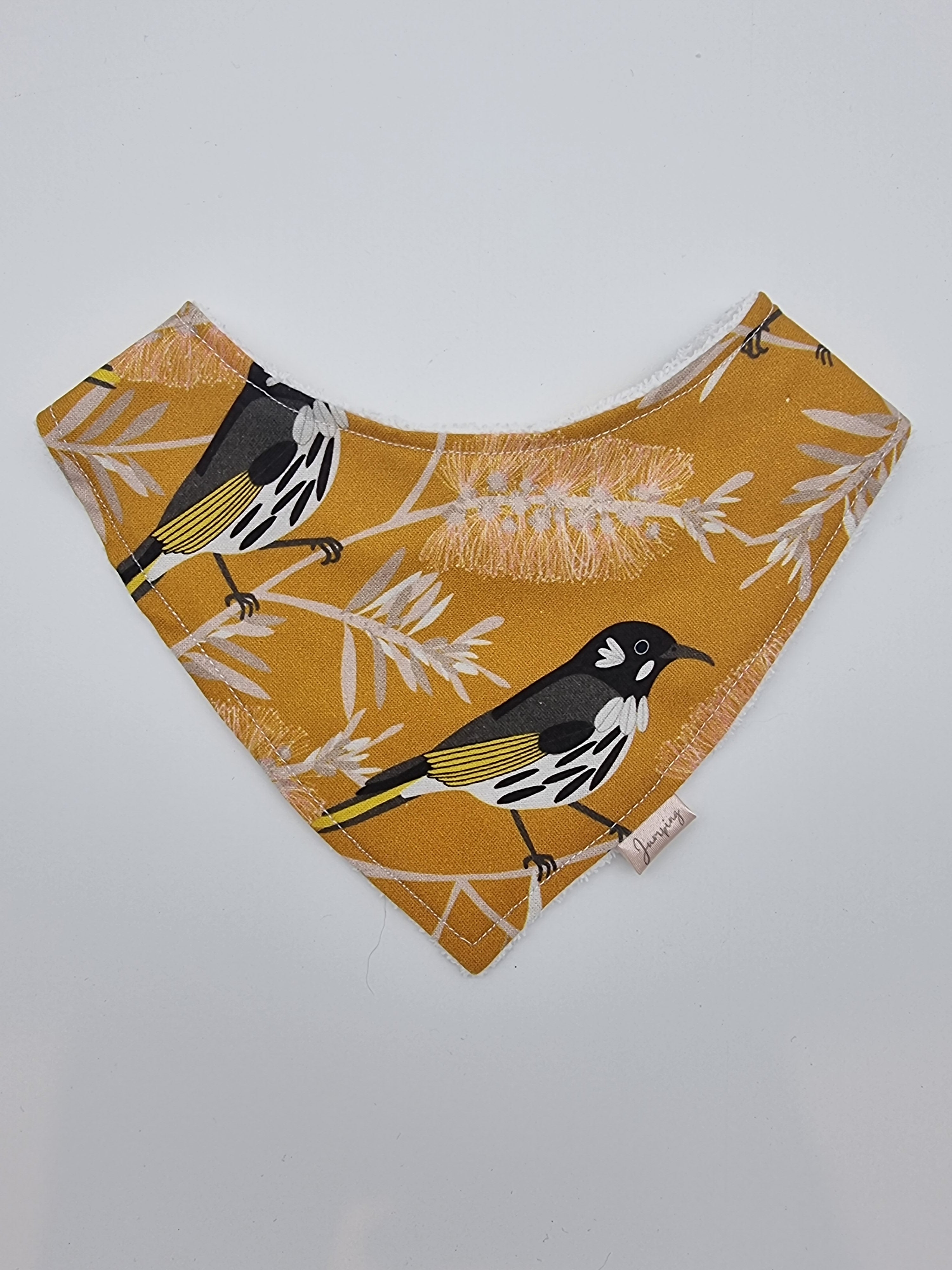 Birds in the bottlebrush tree fitted bib